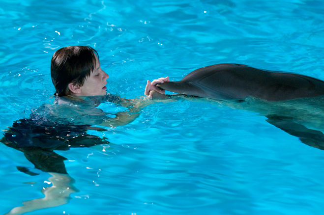 Nathan Gamble with Winter the dolphin