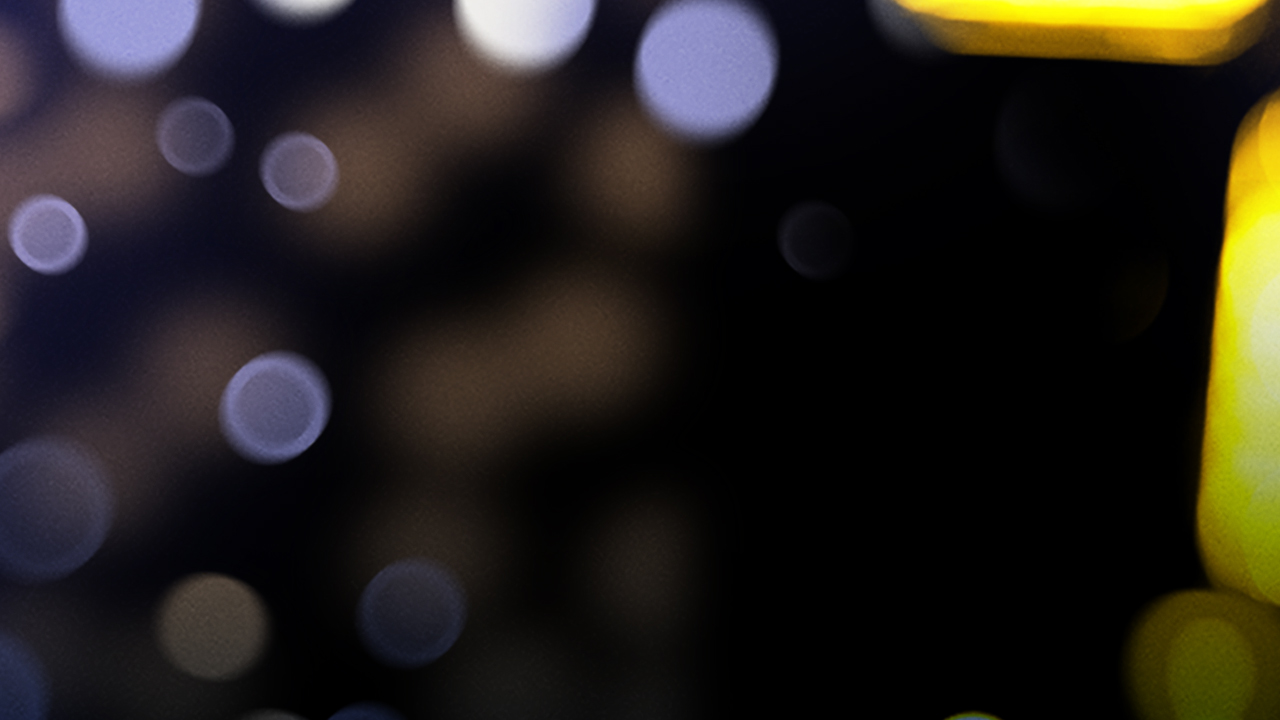 Purple and yellow twinkle lights, out of focus